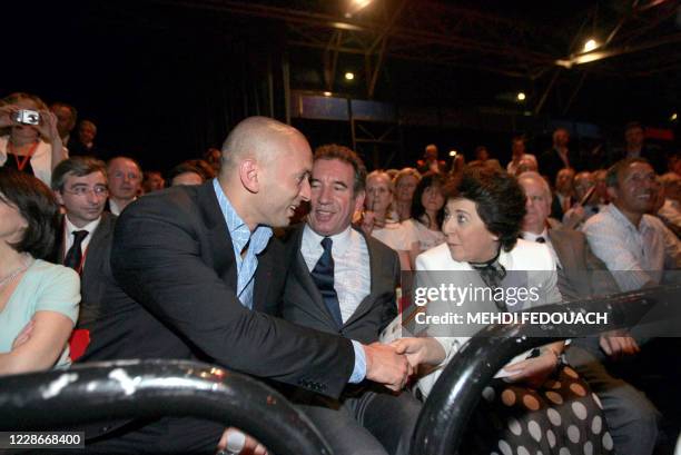 French leader of newly launched Democratic Movement party , Francois Bayrou , sits next to French judoka Djamel Bouras , Former ecology minister,...