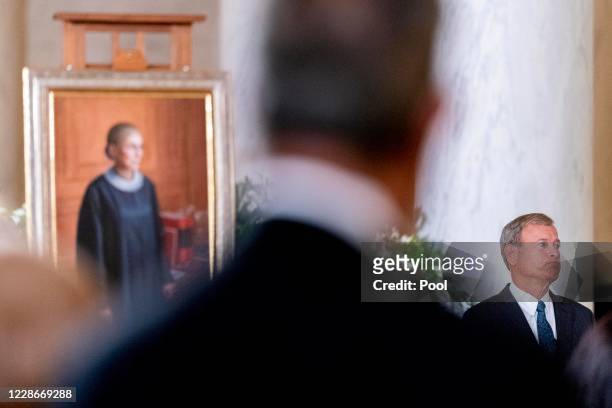 Supreme Court Chief Justice John Roberts, asks for a moment of silence while speaking during a private ceremony for Associate Justice Ruth Bader...