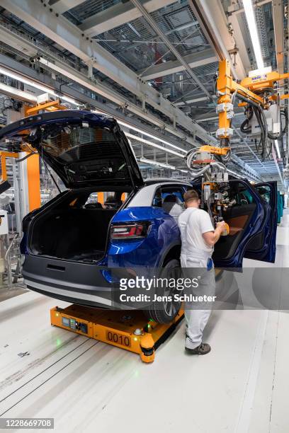 Worker assembles the new Volkswagen ID.4 electric sport utility vehicle at the VW factory on September 18, 2020 in Zwickau, Germany. Volkswagen will...