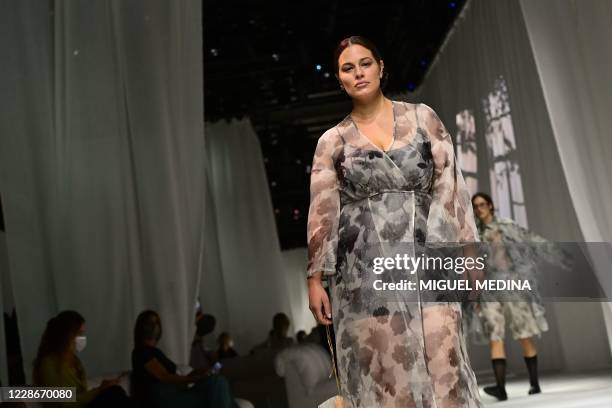 Model Ashley Graham presents a creation by Fendi's Spring/Summer 2021 women's and mens collection during the Milan Fashion Week, on September 23,...