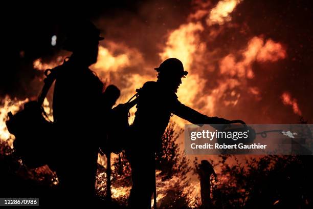 Angeles National Forest, CA, Tuesday, September 22, 2020 - Blue Ridge Hot Shots crew members from Arizona join forces with California firefighters...