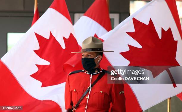 Royal Canadian Mounted Police officer stands guard outside the Senate of Canada prior to the Speech from the Throne September 23, 2020 in Ottawa,...