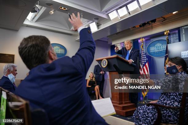 President Donald Trump calls reporters for questions during a press conference in the Brady Briefing Room of the White House on September 23 in...