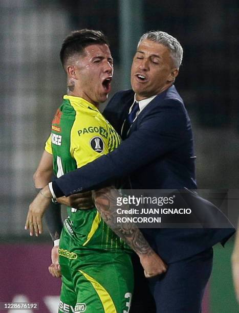 Argentina's Defensa y Justicia Enzo Fernandez celebrates with coach Hernan Crespo after teammate Braian Romero scored the tema's second goal against...