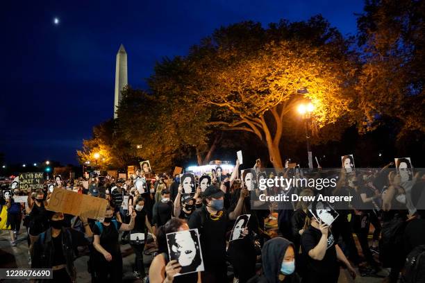 Demonstrators march near the White House in protest following a Kentucky grand jury decision in the Breonna Taylor case on September 23, 2020 in...