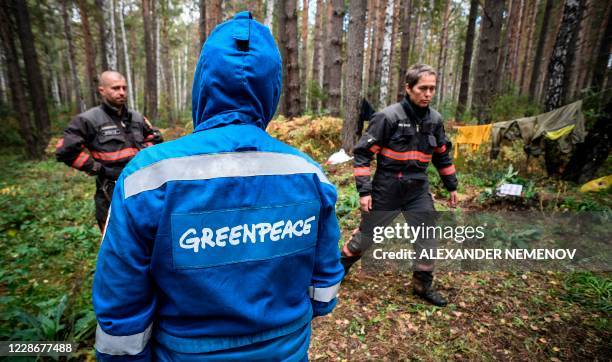 Greenpeace activists set up a camp preparing to extinguish a peat fire in a Suzunsky forest next to the village of Shipunovo, 170 kms south from...