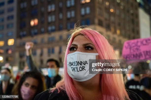 Protesters gather at 59th St. And Fifth Avenue after a judge announced the charges brought by a grand jury against Detective Brett Hankison, one of...
