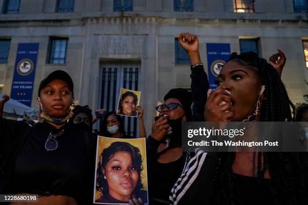 Demonstrators gather at the U.S. Department of Justice before marching to the White House in a call for justice for Breonna Taylor, who was killed by...