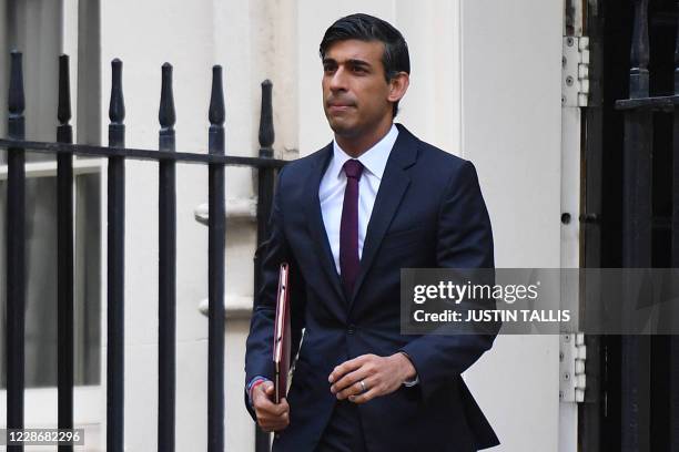 Britain's Chancellor of the Exchequer Rishi Sunak leaves number 11 Downing street in central London on September 24 on his way to present his Winter...