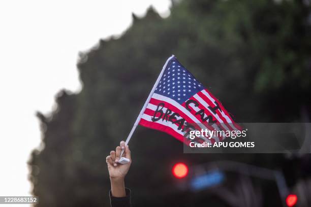 Protesters march against police brutality in Los Angeles, on September 23 following a decision on the Breonna Taylor case in Louisville, Kentucky. A...