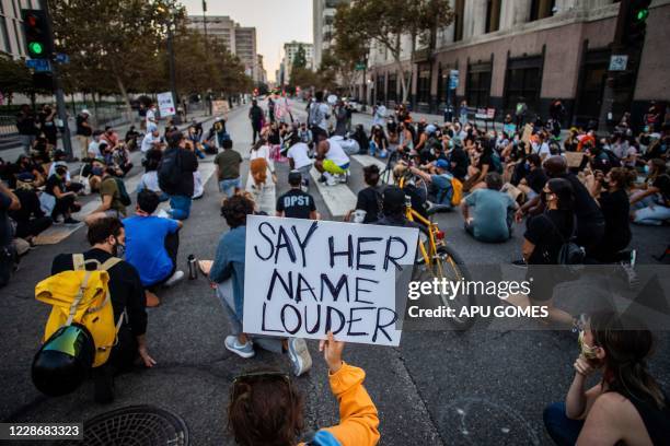 Protesters kneel as they demonstrate in Los Angeles, on September 23 following a decision on the Breonna Taylor case in Louisville, Kentucky. A judge...