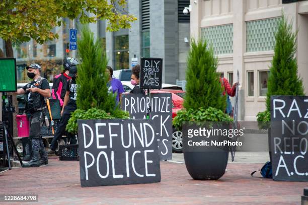 Demonstrators hold up signs in protest at the Hamilton County Courthouse following the Breonna Taylor decision earlier in the day in Louisville,...