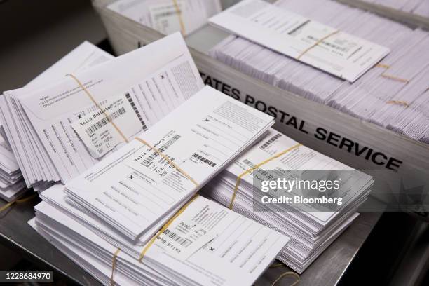 Sample voting ballots sit in a pile during a training on a new ballot sorting machine at the Board of Elections in Doylestown, Pennsylvania, U.S., on...
