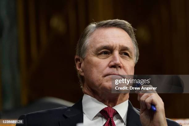 Sen. David Perdue attends a Senate Banking Committee hearing on Capitol Hill on September 24, 2020 in Washington, DC. U.S. Treasury Secretary Steven...