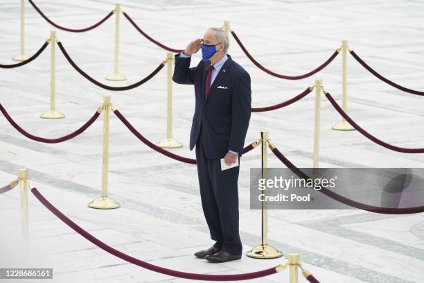 Sen. Tom Carper , pays respects as Justice Ruth Bader Ginsburg lies in repose under the Portico at the top of the front steps of the U.S. Supreme...