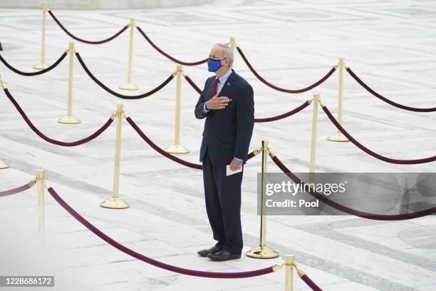 Sen. Tom Carper , pays respects as Justice Ruth Bader Ginsburg lies in repose under the Portico at the top of the front steps of the U.S. Supreme...