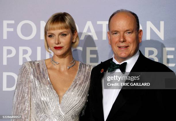 Prince Albert II of Monaco and Princess Charlene of Monaco pose on the red carpet ahead of the 2020 Monte-Carlo Gala for Planetary Health in Monaco...