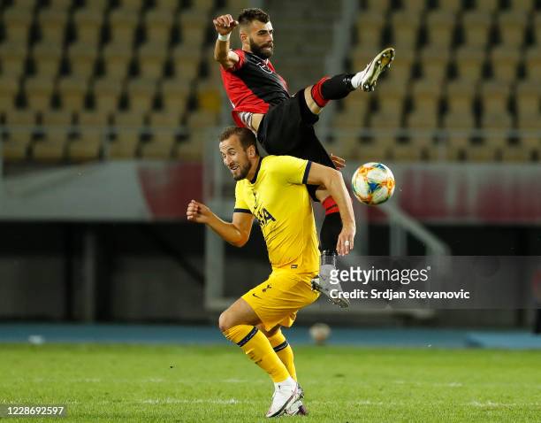 Harry Kane of Tottenham Hotspurs in action against Egzon Bejtulai of Skendija during the UEFA Europa League third round qualifying match between...