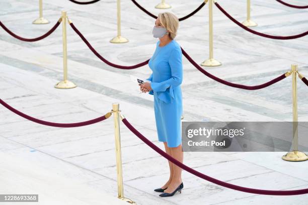 Education Secretary Betsy DeVos pays respects as Justice Ruth Bader Ginsburg lies in repose under the Portico at the top of the front steps of the...