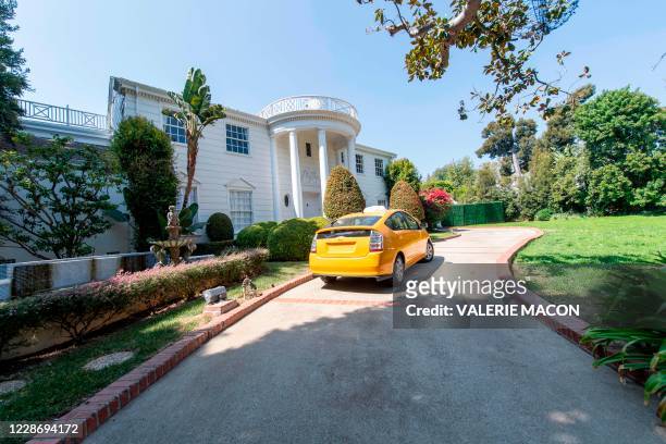 Yellow cab drives by the "Fresh Prince of Bel Air" mansion, just like in the series opening credits, on September 24 in Brentwood, California. - The...
