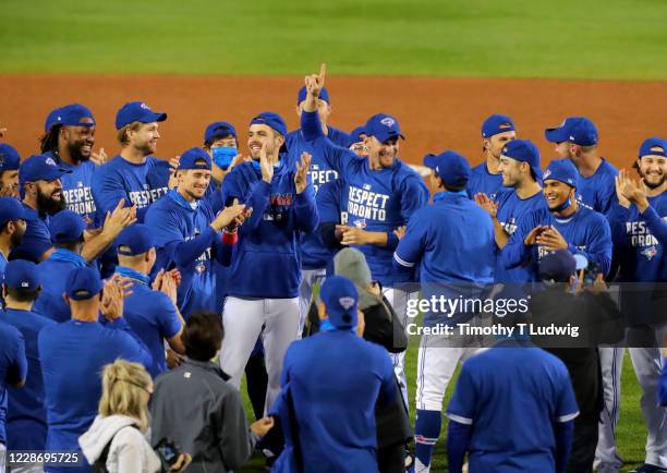 The Toronto Blue Jays celebrate a win against the New York Yankees at Sahlen Field and celebrate a 2020 postseason berth on September 24, 2020 in...