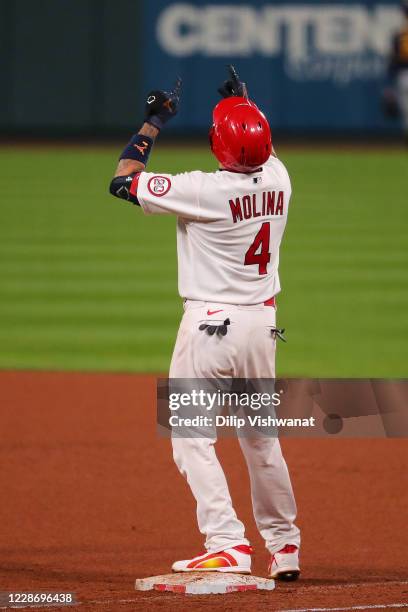 Yadier Molina of the St. Louis Cardinals celebrates after recording his 2,000th career hit with a single against the Milwaukee Brewers in the seventh...