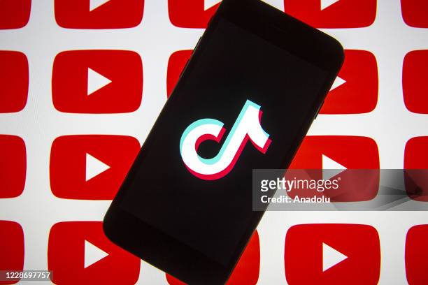 In this photo illustration, a mobile phone screen displays the logo of TikTok near the logo of Youtube in Ankara, Turkey on September 24, 2020.