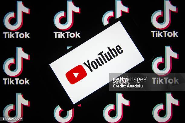 In this photo illustration, a mobile phone screen displays the logo of Youtube near the logo of TikTok in Ankara, Turkey on September 24, 2020.