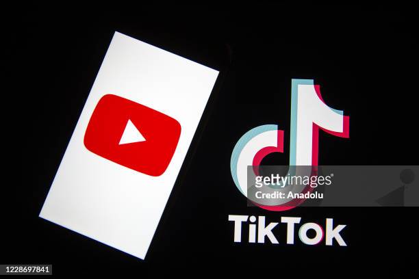 In this photo illustration, a mobile phone screen displays the logo of Youtube near the logo of TikTok in Ankara, Turkey on September 24, 2020.