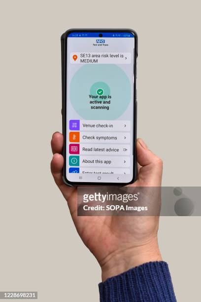 In this photo illustration the NHS Test and Trace app which has been launched in England and Wales is displayed on a smartphone. People have been...