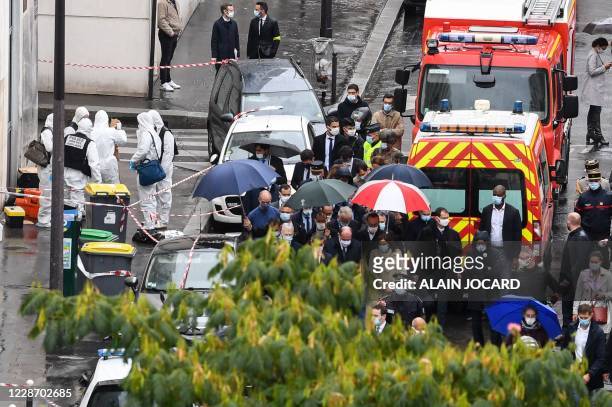 French Prime Minister Jean Castex , French Interior minister Gerald Darmanin and the Mayor of Paris Anne Hidalgo arrive at the scene where several...
