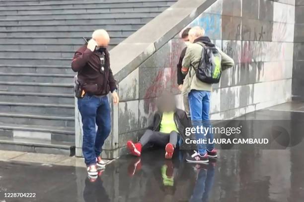 This grab taken from a video obtained by AFP shows French police detaining an alleged suspect after several people were injured near the former...