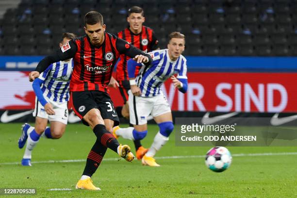 Frankfurt's Portuguese forward Andre Silva scores the opening goal from the penalty spot during the German first division Bundesliga football match...