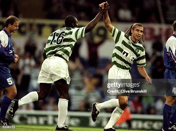 Oliver Tebily of Celtic celebrates his goal with team-mate Henrik Larsson during UEFA Cup First Round first leg match against Cwmbran played in...