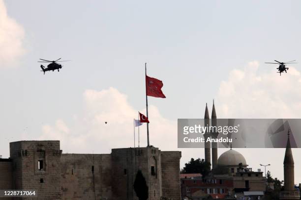 Attack helicopters perform around Gaziantep Castle during the third day of the Space and Technology Festival in Gaziantep, Turkey on September 26,...