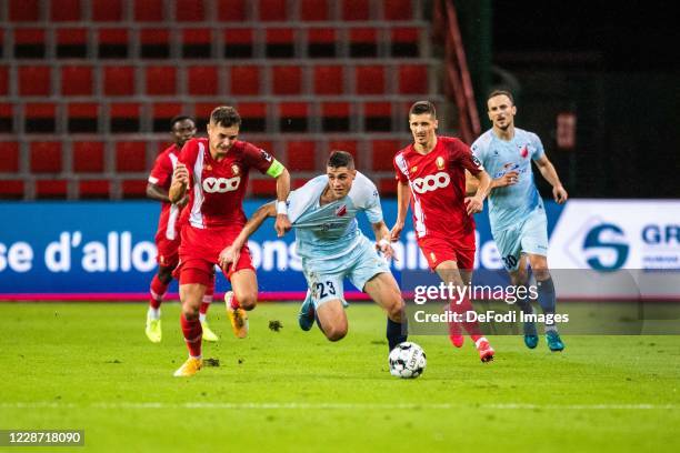 Momcilo Mrkajic of 1. FK Vojvodina and Zinho Vanheusden of Standard Liege battle for the ball during the UEFA Europa League third qualifying round...