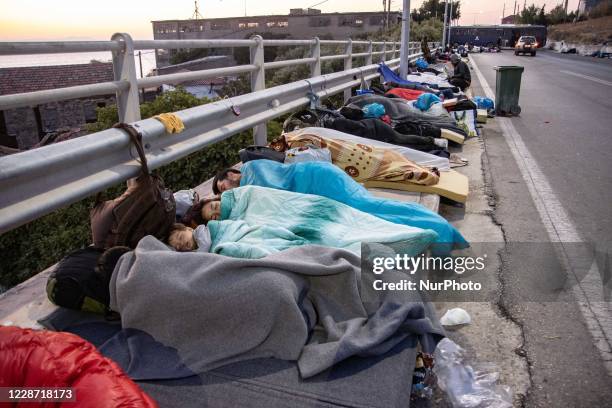 Refugees and migrants sleeping on the streets. Early morning with more than 10.000 Asylum Seekers sleep roadside after the fire in Moria Refugee...