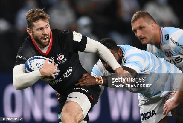 Saracens' full back Elliot Daly vies with Racing's French centre Virimi Vakatawa during the European Rugby Champions Cup semi-final rugby union match...