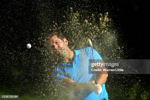 Robert Rock of England hits a bunker shot on the 5th hole during Day Three of the Dubai Duty Free Irish Open at Galgorm Spa & Golf Resort on...