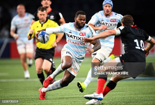 Racing's French outside centre Virimi Vakatawa runs the ball during the European Rugby Champions Cup semi-final rugby union match between Racing 92...