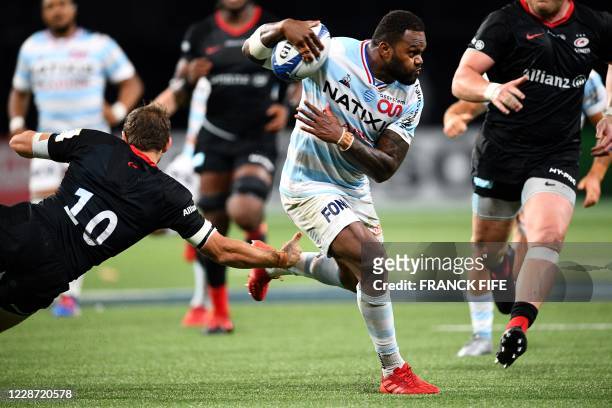 Racing's French outside centre Virimi Vakatawa runs with the ball during the European Rugby Champions Cup semi-final rugby union match between Racing...