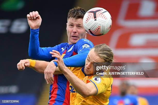 Crystal Palace's Scottish-born Irish midfielder James McCarthy vies with Everton's English midfielder Tom Davies during the English Premier League...