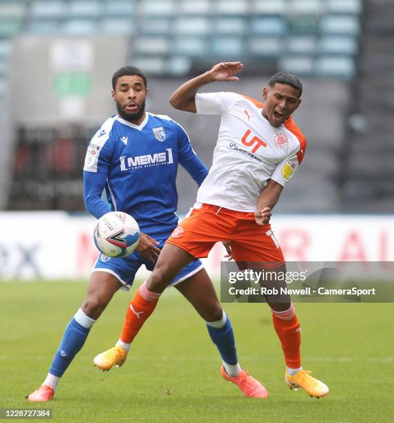 Gillingham's Dominic Samuel and Blackpool's Demitri Mitchell during the Sky Bet League One match between Gillingham and Blackpool at MEMS Priestfield...