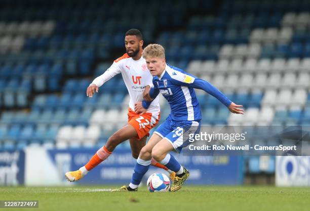 Gillingham's Scott Robertson and Blackpool's CJ Hamilton during the Sky Bet League One match between Gillingham and Blackpool at MEMS Priestfield...
