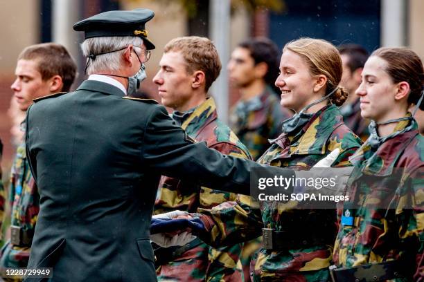 King Philippe reviews the first-year students and congratulates his daughter, Princess Elisabeth. King Philipe and Queen Mathilde attend the Blue...