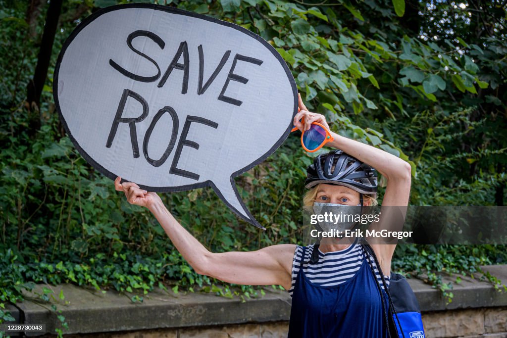 Participant holding a Save Roe sign at the protest. Political... News ...