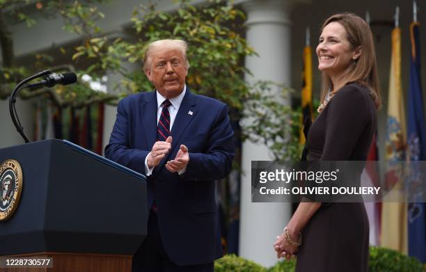 President Donald Trump announces his US Supreme Court nominee, Judge Amy Coney Barrett , in the Rose Garden of the White House in Washington, DC on...