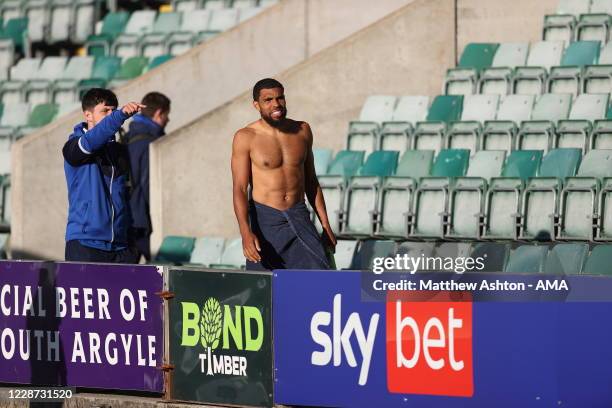 Scott Golbourne of Shrewsbury Town receives directions on where to take a shower after the match with the away dressing room in a make shift location...