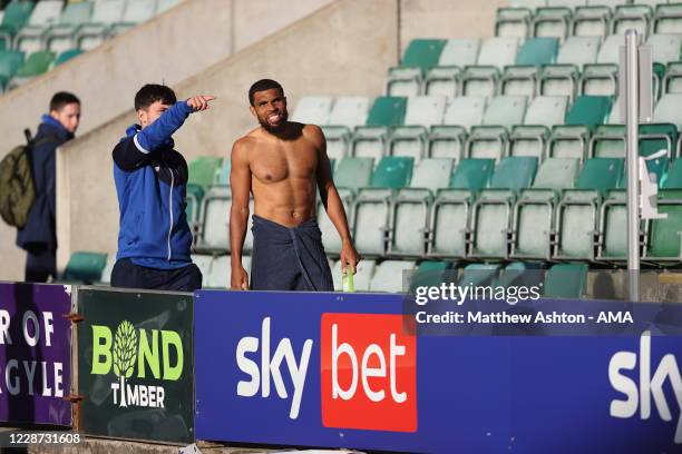 Scott Golbourne of Shrewsbury Town receives directions on where to take a shower after the match with the away dressing room in a make shift location...