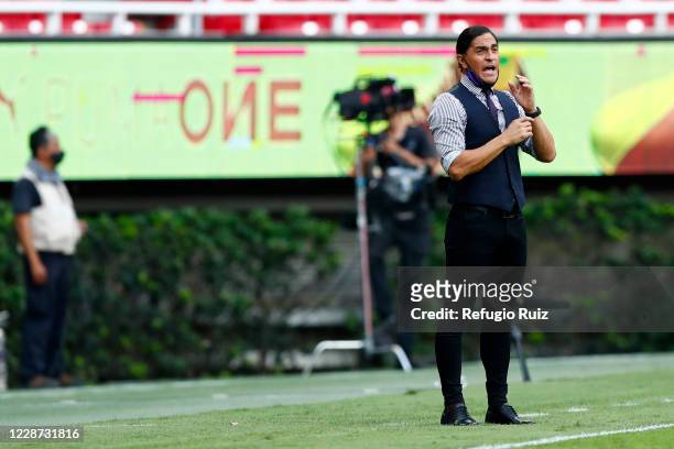Francisco Palencia, coach of Mazatlan gives instructions to his players during the 12th round match between Chivas and Mazatlan FC as part of the...